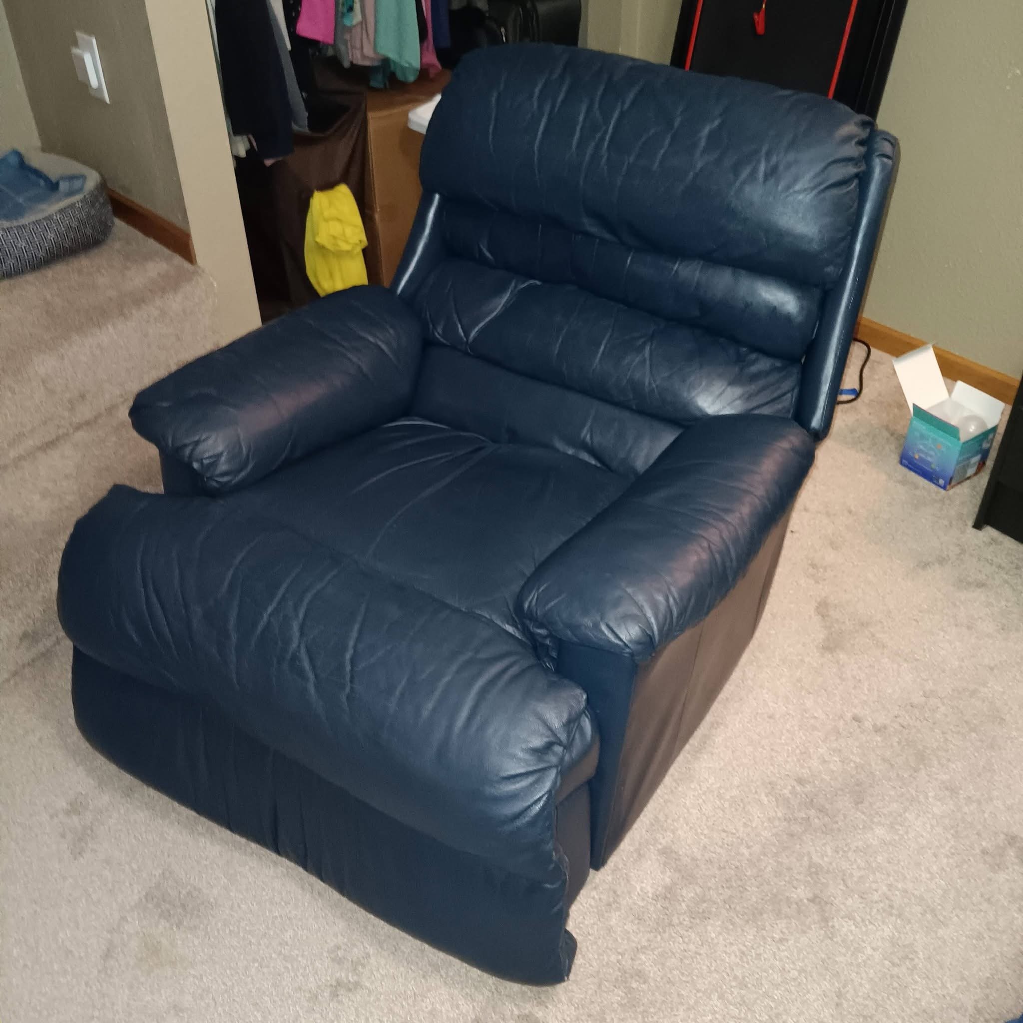 Vibrant, clean blue leather recliner after expert upholstery restoration
